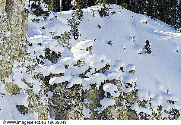 Snow clumps balanced on rocks in Yellowstone National Park  Wyoming.