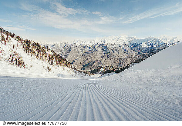 Snow covered landscape with skiing tracks