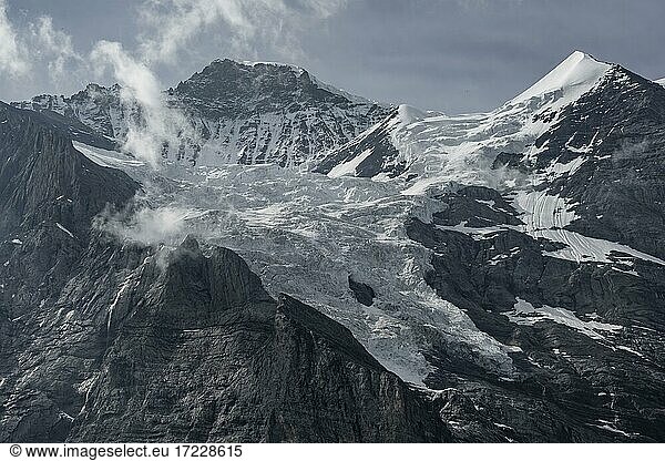 Snow covered mountain peaks Jungfrau and Silberhorn with glacier Jungfraufirn  Bernese Alps  Bernese Oberland  Switzerland  Europe