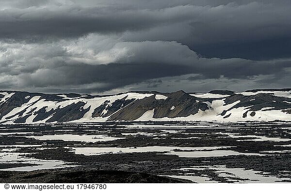 Snow-covered volcanic landscape with volcanic sand and petrified lava  crater of Askja volcano  Icelandic highlands  Iceland  Europe