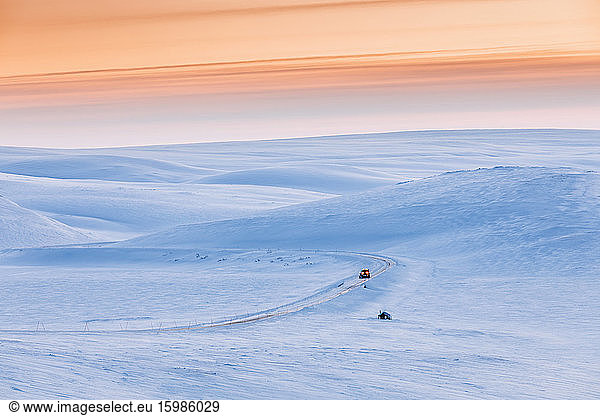 Snow plow truck on country road in winter  Berlevag  Norway