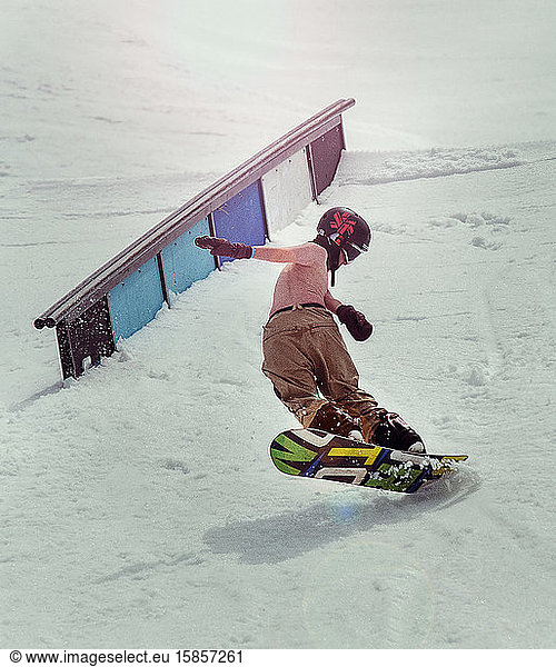 snowboarder teen doing trick in Lake Tahoe