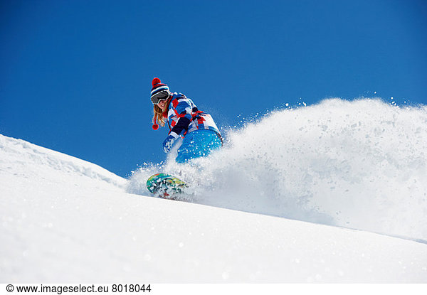 Snowboarderin in Aktion