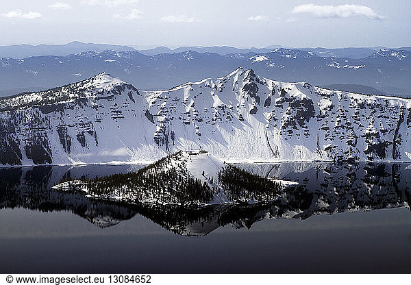 Snowcapped wizard island in crater lake