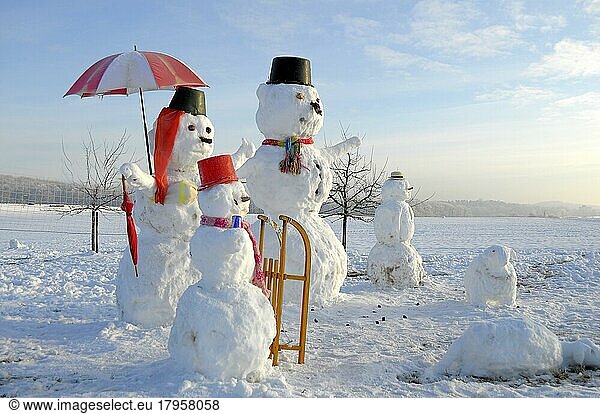 Snowman Family with animal figures  winter landscape Snowman Family with animal figures  winter landscape