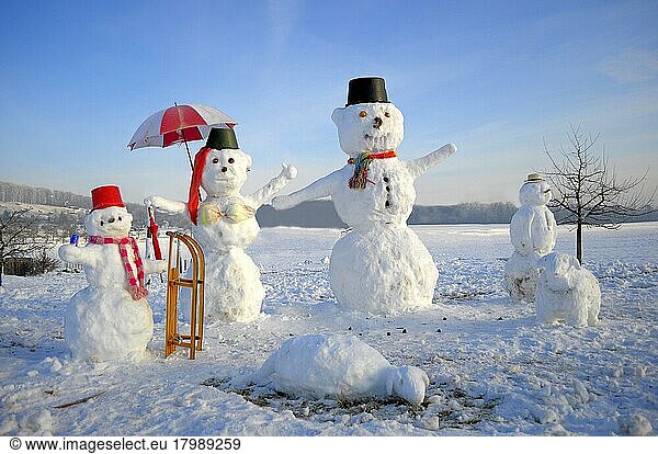 Snowman Family with animal figures  winter landscape Snowman Family with animal figures  winter landscape