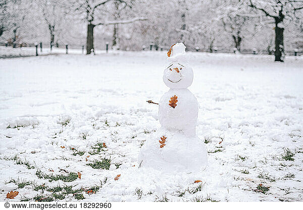 Snowman standing in snow-covered park