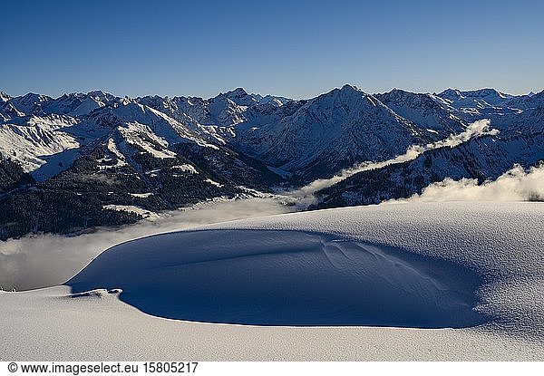 Snowy landscape with clouds and Allgäu Alps  Ritzlern  Kleinwalsertal  Vorarlberg  Austria  Europe