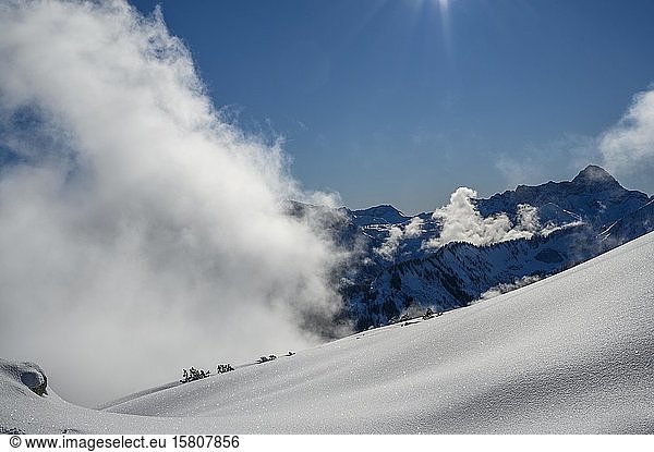 Snowy landscape with clouds and Allgäu Alps  Ritzlern  Kleinwalsertal  Vorarlberg  Austria  Europe