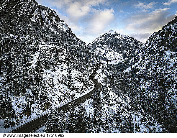 snowy road snakes through mountains  Red Mountain Pass  Colorado