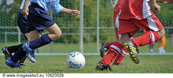 Soccer game  children  football player and soccer ball