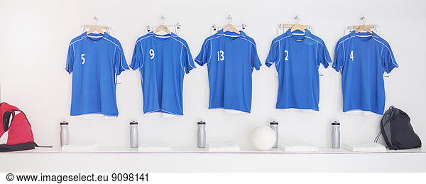 Soccer team uniforms in locker room