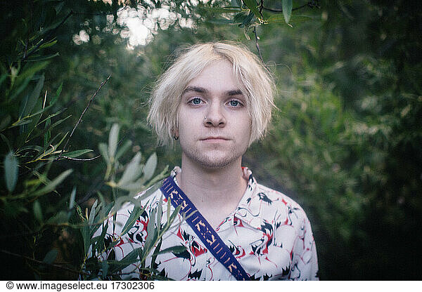 Soft Portrait of Blue Eyed Teen Boy in the Woods