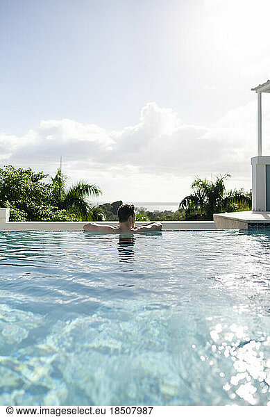 Solo man enjoying the pool on a sunny day in Puerto Rico