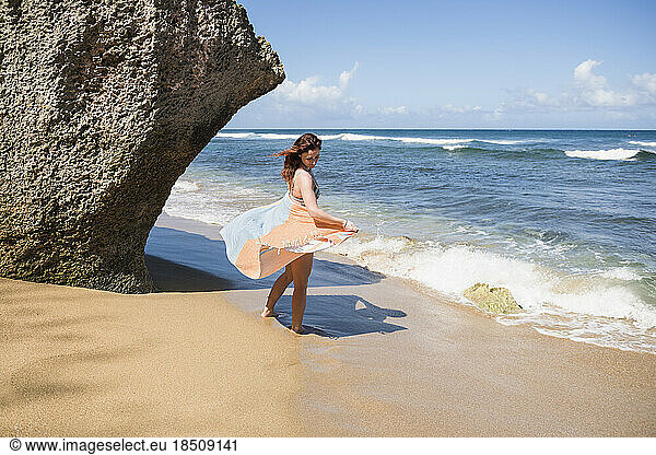 Solo Woman in a bikini with towel at the beach in Puerto Rico