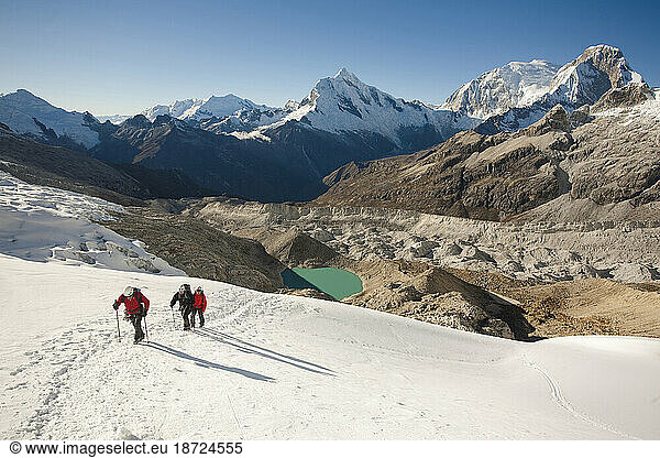 some men trekking on a glacier  Cordillera Blanca  Peru.