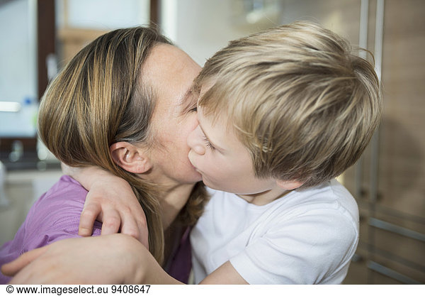 Son kissing his mother