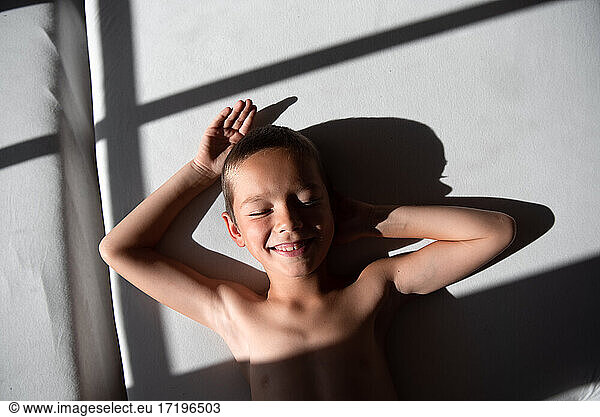 son laughs and enjoys the sun
