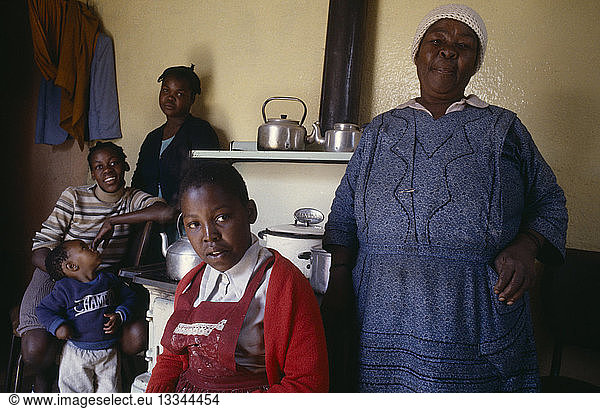 SOUTH AFRICA Gauteng Soweto Portrait of family in domestic interior.