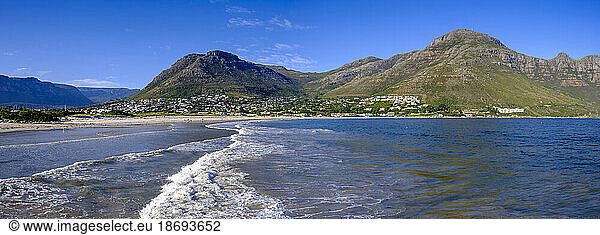 South Africa  Western Cape Province  Hout Bay  Panoramic view of coastal town with mountains in background