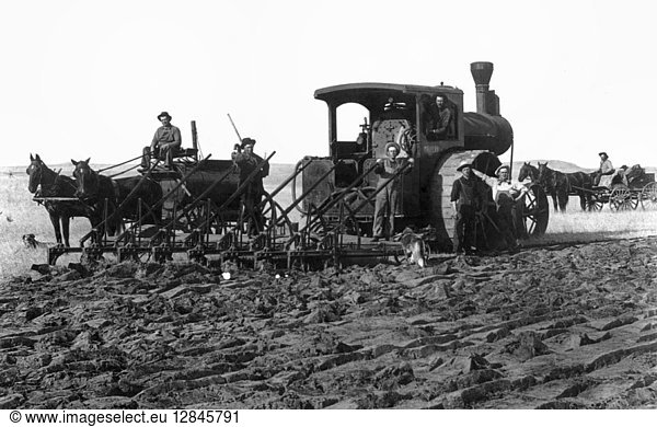 SOUTH DAKOTA: FARMING. A farmer breaking sod with a large tractor and plow  powered by a horse-drawn wagon and tank. Photograph  c1910.