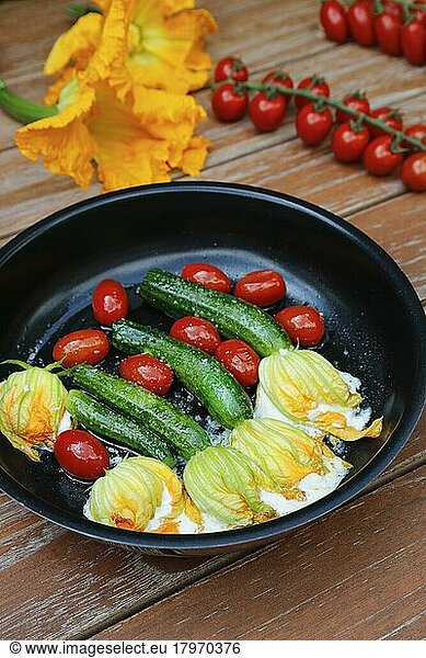 Southern German cuisine  stuffed courgette flowers sautéed in pan  cream cheese  cocktail tomatoes  cherry tomatoes  vegetarian  healthy cuisine  vegetables  Germany  Europe