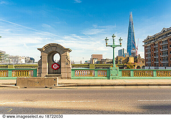 Southwark Bridge with the shard tower with blue sky and tower bridge
