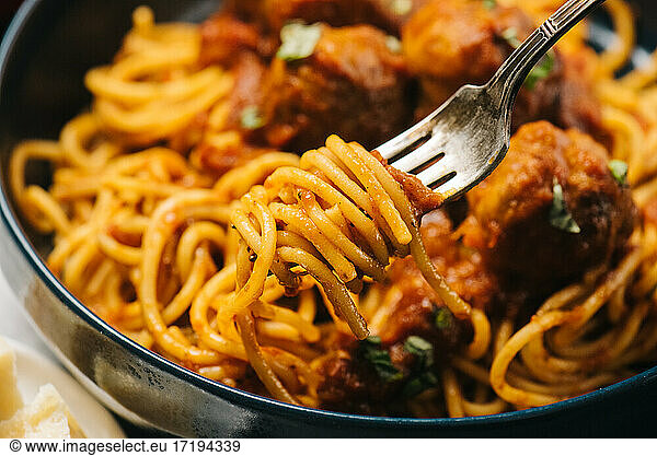 Spaghetti spun onto a fork closeup