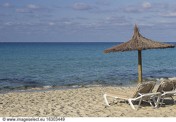 Spain,  Formentera,  Es Arenals,  sunshade and beach chairs