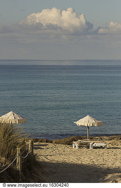 Spain,  Formentera,  Es Arenals,  sunshades and beach chairs