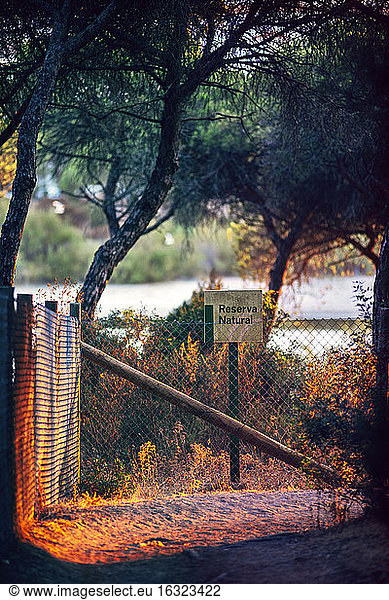 Spain  Andalusia  Huelva  fence and sign at nature park