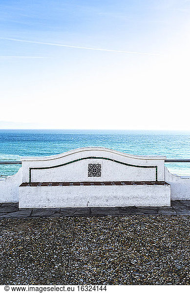 Spain  Andalusia  Tarifa  stone bench in front at coast