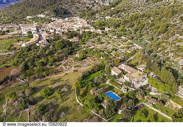 Spain  Balearic Islands  Caimari  Aerial view of finca and rural village in Serra de Tramuntana range during spring