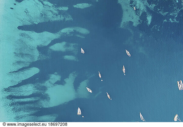 Spain  Balearic Islands  Formentera  Drone view of boats floating on blue surface of Mediterranean Sea
