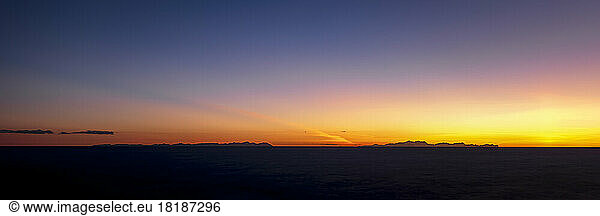 Spain  Balearic Islands  Menorca  Panoramic sunset over Mallorca