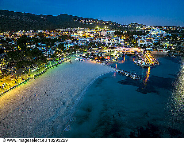 Spain  Balearic Islands  Santa Ponsa  Mallorca  Aerial view of illuminated seaside town at dusk