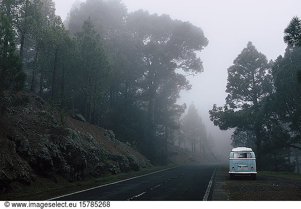 Spain  Canary Islands  Tenerife  Van parked by misty highway