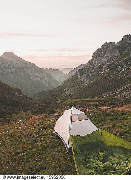 Spain  Cantabria  White tent pitched in Picos de Europa at dawn