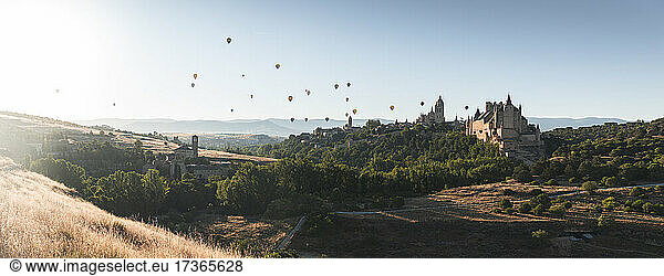 Spain  Castile and Leon  Segovia  Hot air balloons flying Segovia Cathedral and Alcazar of Segovia