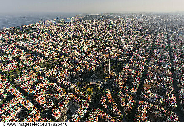 Spain  Catalonia  Barcelona  Helicopter view of Sagrada Familia basilica and surrounding cityscape