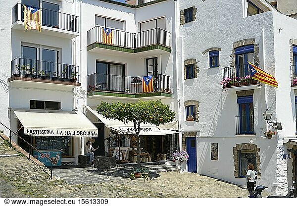 Spain  Catalonia  Costa Brava  province of Girona  Cadaques  cake shop at the foot of a building in white facades decorated with flags of Catalonia