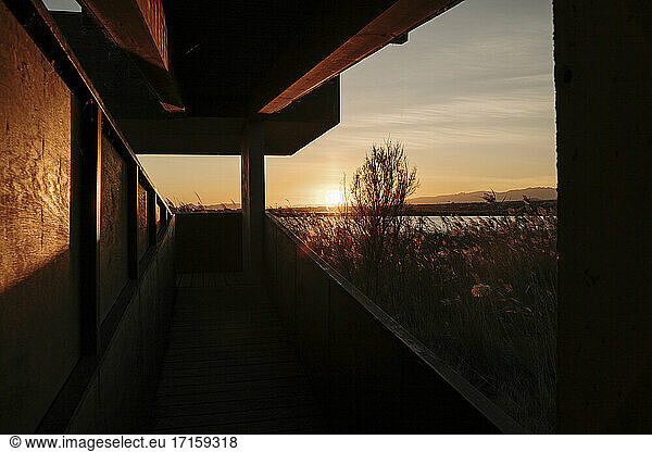 Spain  Ebro Delta  Sunset over landscape with architecture element