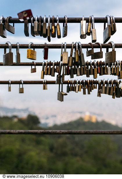 Spain  love padlocks on Tibidabo mount with Barcelona city in the background