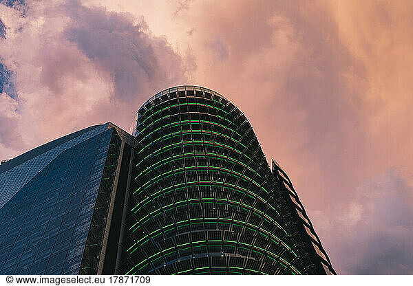 Spain  Madrid  Storm clouds over Torre Titania mall at dusk