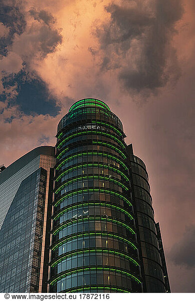 Spain  Madrid  Storm clouds over Torre Titania mall at dusk