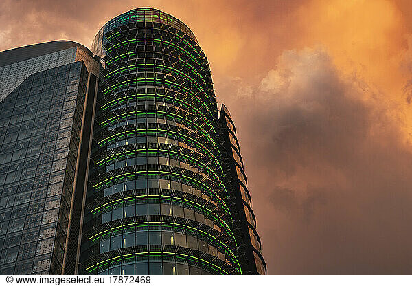 Spain  Madrid  Storm clouds over Torre Titania mall at dusk