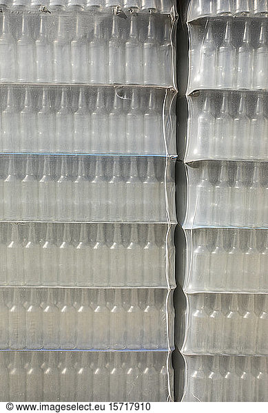 Spain  Mallorca  Stacks of glass bottles wrapped in plastic