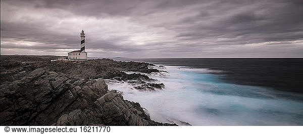 Spain  Menorca  Favaritx  View of lighthouse at sunset