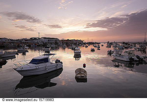 Spain  Province of Huelva  Isla Cristina  Boats moored in harbor at dusk