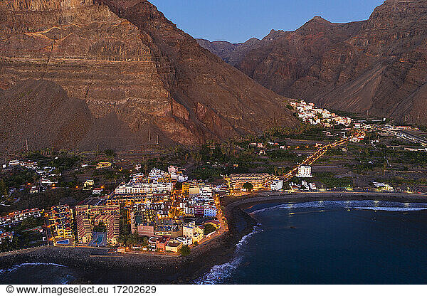 Spain  Valle Gran Rey  Drone view of town at edge of La Gomera island at dusk
